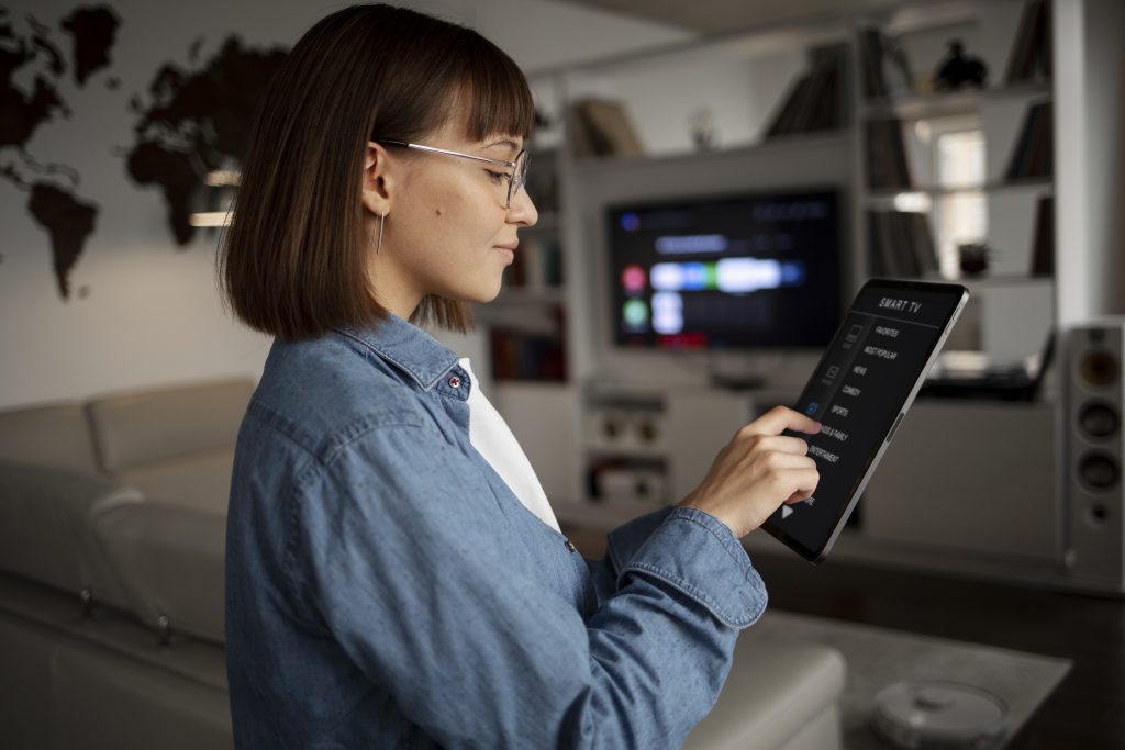 young woman using home technology i home plus